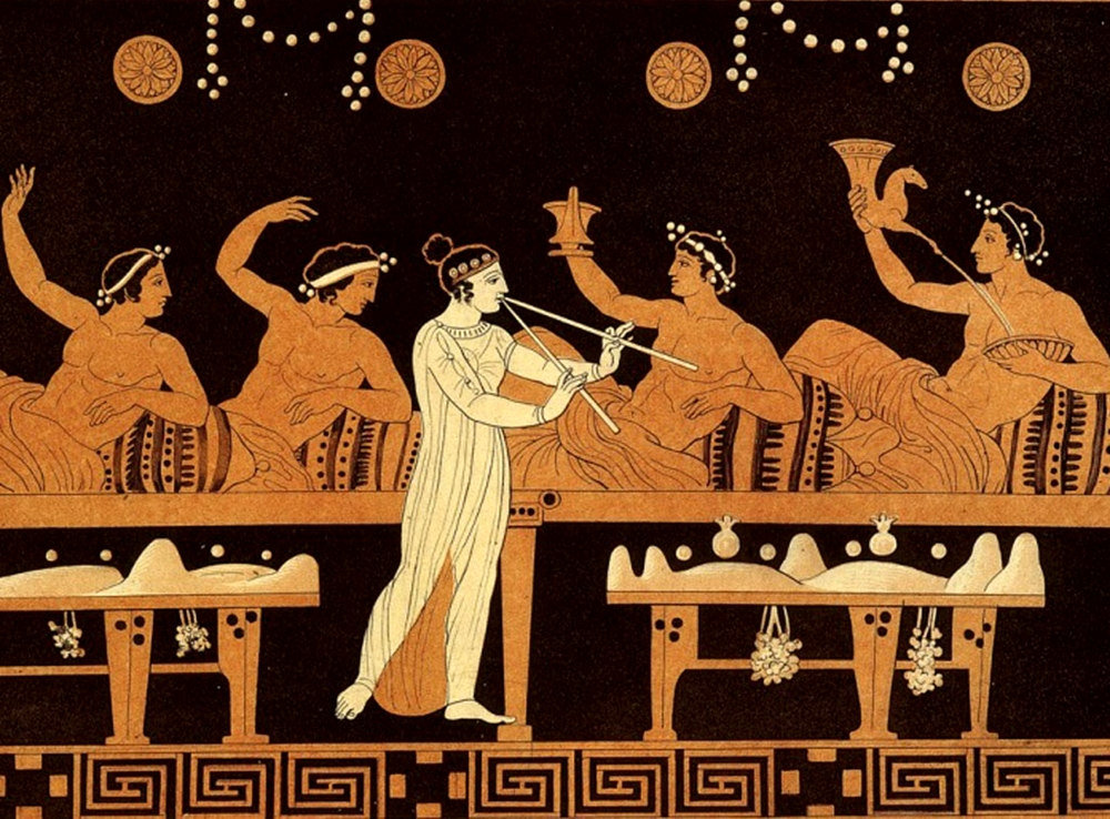 Scena di simposio tratta da un vaso greco a figure rosse del V sec. a.C.
